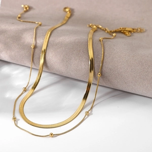Detail of 18K gold-plated double-layer necklace set with snake chain and bead chain