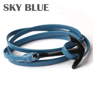 Detailed macro view of sky blue multilayer leather bracelet with black anchor clasp