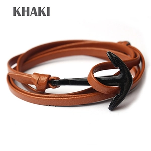 Detailed close-up of khaki leather multi-layer wrap bracelet with black metal anchor clasp