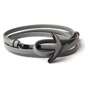 Minimalist grey leather wrap bracelet featuring a matte black metal anchor clasp design
