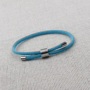 Sky blue braided rope bracelet with adjustable metal buckles and minimalist design