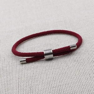 Minimalist deep red woven cord bracelet with polished silver metal decorative beads