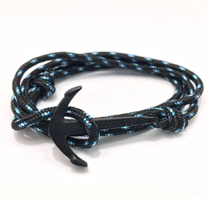 Close-up of black matte anchor clasp with Vikings engraving and tricolor braided rope