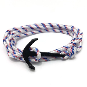 Detail of nautical tricolor woven rope bracelet with black matte anchor clasp and Vikings logo