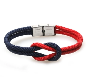 Detail of red and navy woven rope bracelet with stainless steel magnetic buckle clasp