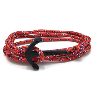 Macro shot of Viking braided rope bracelet with black anchor clasp and laser engraving