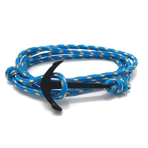 Detail of blue and orange nautical rope bracelet with black anchor buckle and VIKINGS engraving