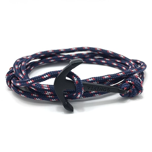 Detailed view of nautical rope bracelet featuring a black metal anchor with Vikings engraving