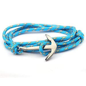 Detail of nautical tri-color nylon braided rope bracelet with polished silver anchor clasp