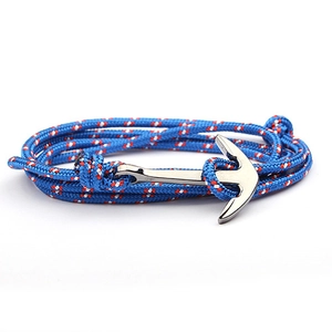 Close-up of anchor bracelet with navy blue nylon rope and silver metal clasp detail