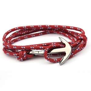 Detail of red and blue 3mm nylon nautical rope bracelet with silver anchor clasp