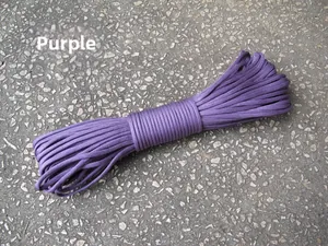 Detailed view of durable purple 7-strand parachute cord with woven texture on gray ground