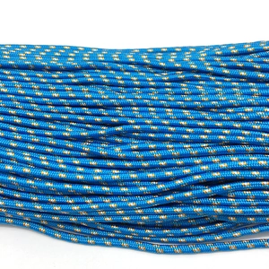 Macro detail of blue paracord with woven orange and white patterns for bracelets