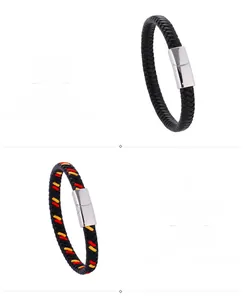 Close-up of black and tricolor braided leather bracelets with silver magnetic clasps