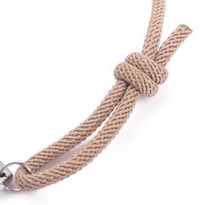 Detailed close-up of khaki woven cord with adjustable knots and durable metal ring