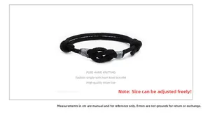 Detail of hand-woven black concentric knot bracelet with adjustable Milan cord band