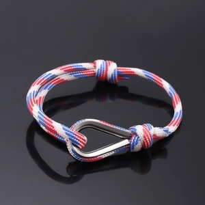 Close-up of tricolor nautical braided rope bracelet with a stainless steel D-shackle clasp