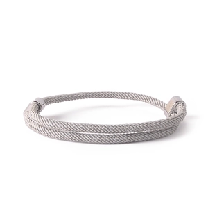 Detail of hand-woven rope bracelet with silver anchor buckle and adjustable double knots