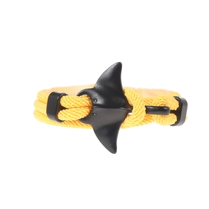 Detail of yellow nylon braided rope with black manta ray anchor clasp on sport bracelet