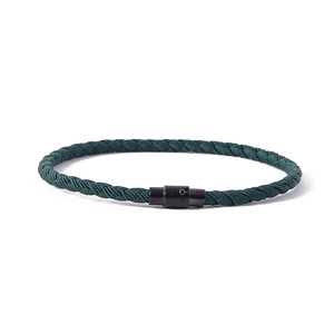 Deep green braided lucky string bracelet featuring a black magnetic closure for couples