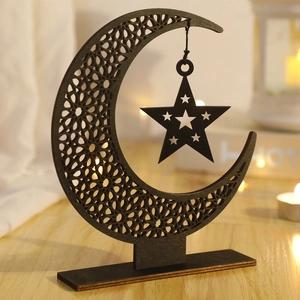 Detailed laser-cut black wood star and moon ornament with intricate geometric patterns