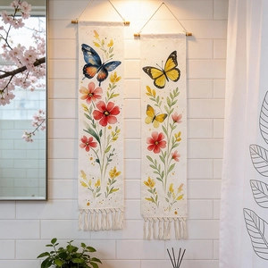 Detail of bohemian woven wall tapestries with butterfly prints and elegant tassels