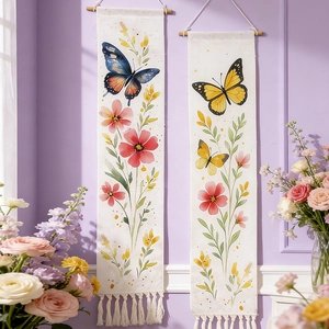 Detail of bohemian butterfly floral wall hanging with wooden rod and cotton tassels