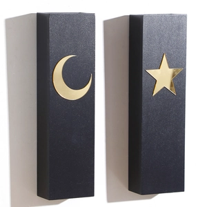 Minimalist black wooden wall shelves with golden star and moon patterns for home decor