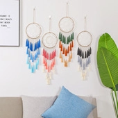 Set of four colorful unicorn dream catchers with gradient tassels for wall decoration
