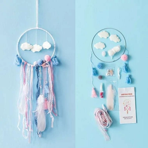 DIY dreamcatcher kit featuring cloud charms, feathers, and ribbons for wall decor