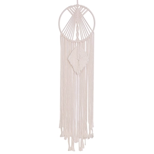 Close-up of handmade bohemian dreamcatcher with intricate cotton weaving and leaf tassel