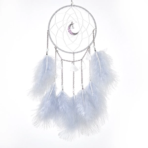 Macro detail of moon dreamcatcher showing silver metal pendant and soft blue feathers