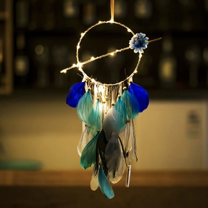 Handmade dream catcher wall hanging with LED warm lights and soft blue and white feathers