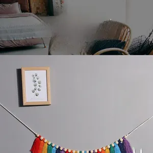 Detailed macro view of colorful handmade macrame rainbow tassel wall hanging with wood beads