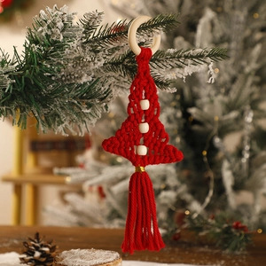 Detail of red macrame Christmas tree ornament with white beads and wooden ring hanging
