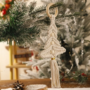 Detailed close-up of handmade macrame Christmas tree wall hanging with cotton rope and wood beads