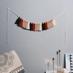 Bohemian macrame wall hanging with earth-tone tassels and wood beads for home decor