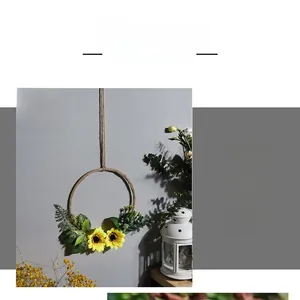 Detail of sunflower wall decor with rustic hemp rope and artificial eucalyptus leaves