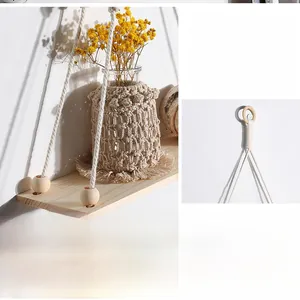 Detail of bohemian handmade woven wall shelf with macrame cotton rope and wooden beads