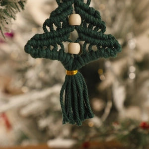 Handmade green macrame Christmas tree wall hanging with wooden beads and golden tassels