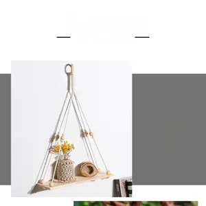 Close-up of bohemian hand-woven tapestry shelf with natural wood beads and cotton rope