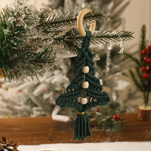 Handmade green macrame Christmas tree wall hanging with wooden beads and fringes