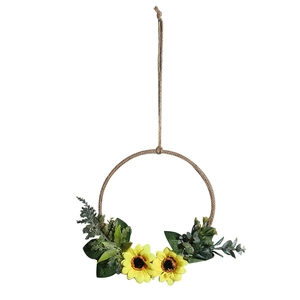 Nordic hanging wall decor with yellow sunflowers and green leaves on a twine hoop
