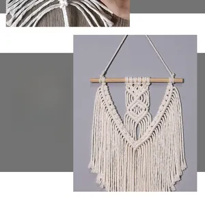 Detail of bohemian hand-woven cotton wall hanging with elegant leaf tassels and wood pole