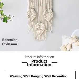 Close-up of bohemian hand-woven cotton wall hanging featuring three leaf patterns and fringe