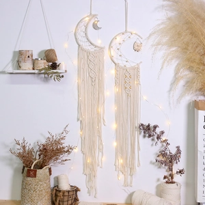 Detail of bohemian cotton woven dreamcatcher with LED lights and moon shape hanging