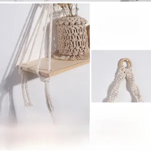 Detail of bohemian hand-woven cotton wall shelf with solid wood board and glass vase