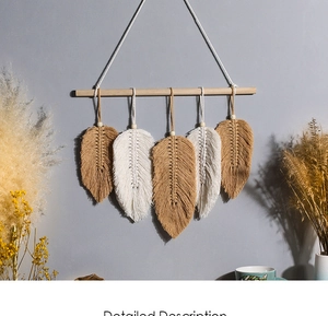 Macro detail of bohemian woven cotton leaf wall hanging with decorative wooden beads