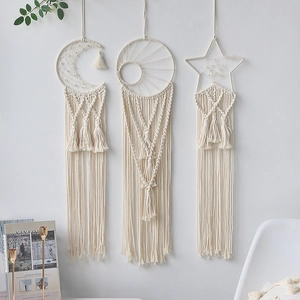 Three-piece macrame wall hanging set featuring moon sun and star shapes in boho style