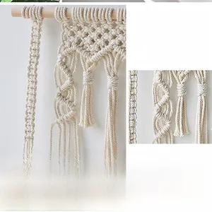 Detail of bohemian macrame wall hanging showing intricate handwoven cotton rope patterns